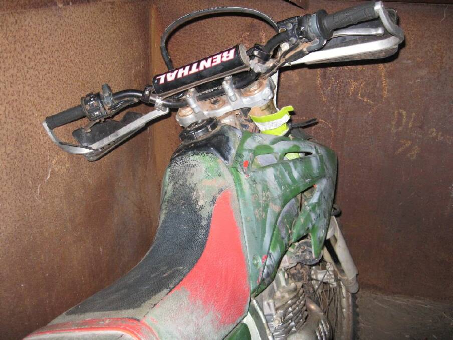 Police are trying to locate the owner of a red and white 2006 Honda XR250L dirt motorcycle.