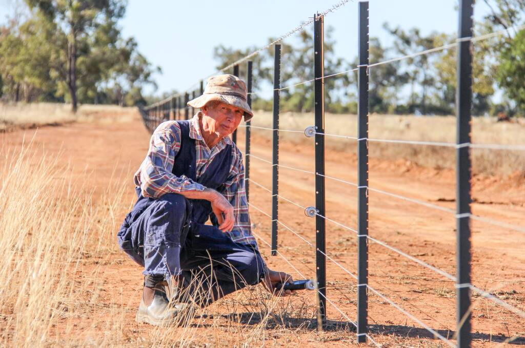 John Ford, Dreamland, Mungallala with the latest of his electric remote monitored fences he built himself. Pictures: Lucy Kinbacher