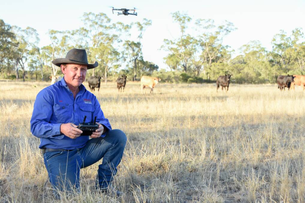Mick Johnson with his drone on his property. 