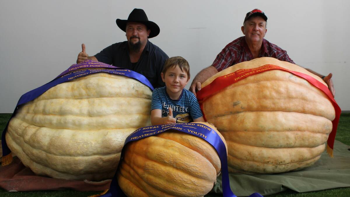 THREE GENERATIONS: Minden's Tony Frohloff, Geoff Frohloff, and Riley Frohloff with their giant pumpkin entries in the Royal Queensland Show. 