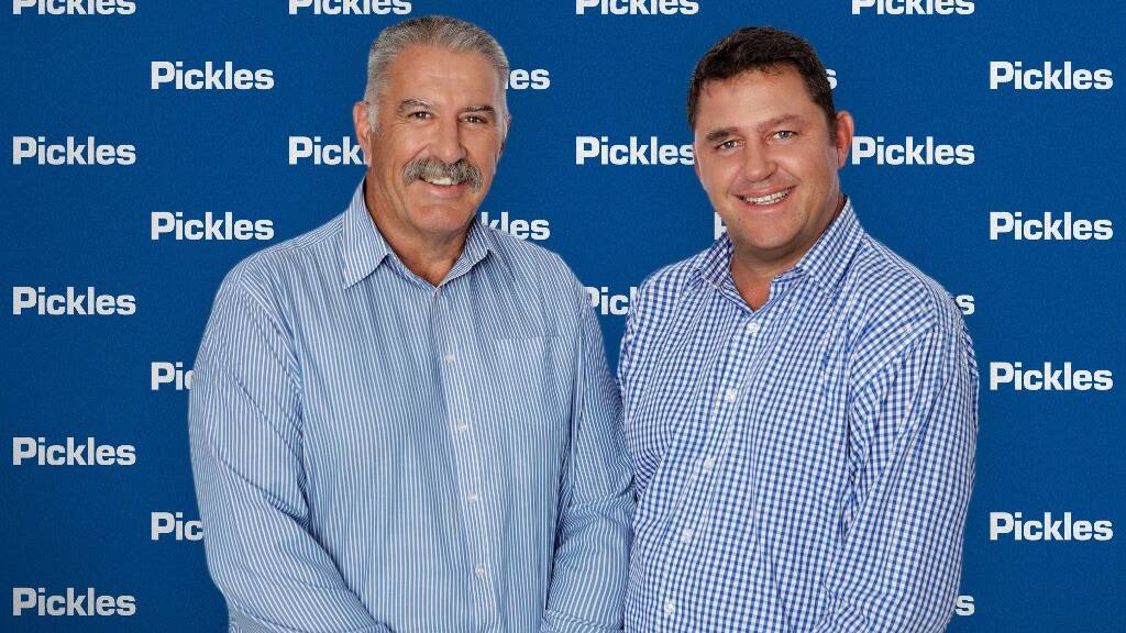 Hassalls general manager Steve Wall and Pickles director industrial Bruce Connors celebrating the aquisition of Hassalls by Pickles. 
