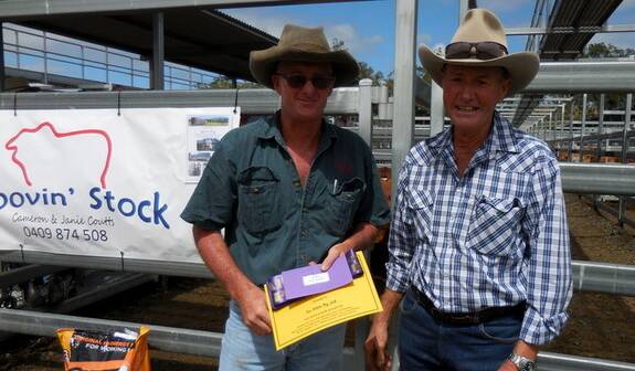 Steven Hardgrave, Tin Horse, Rathdowney, was awarded the prize for the champion pen of the All Red Show and Sale  for his Santa steers by judge Glen Perrett, Goomeri.