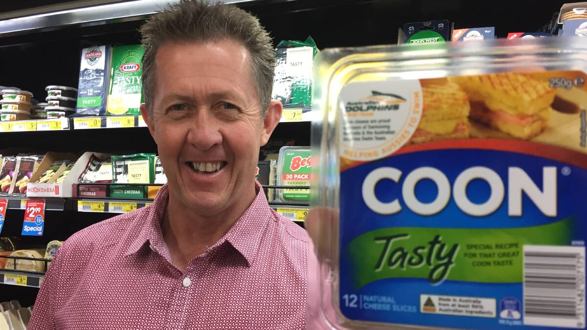 COUNTRY OF ORIGIN: Assistant Minister to the Deputy Prime Minister, Luke Hartsuyker, with cheese bearing the new CoOL labelling.