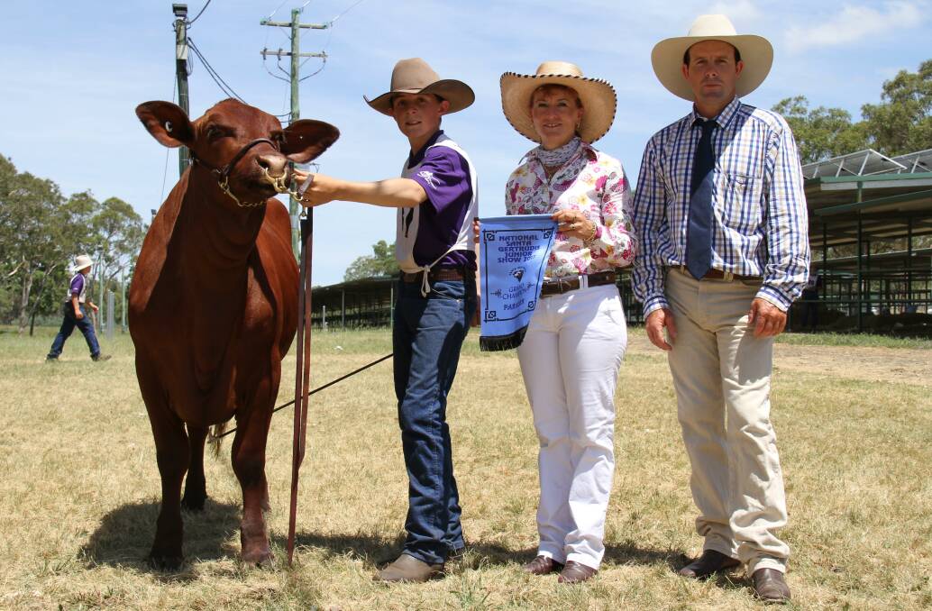 Champion herdsman Mitch Franz with judges Karen Griffiths, Warwick, and Anthony Flint, Goomburra Valley. 