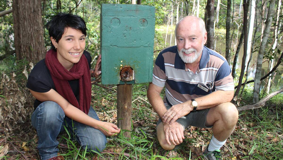 RESEARCH GRANT: USC PhD student Rachele Wilson with Malcolm Cox, the president of the Friends of Maroochy Regional Bushland Botanic Gardens, and a hive of stingless native bees.