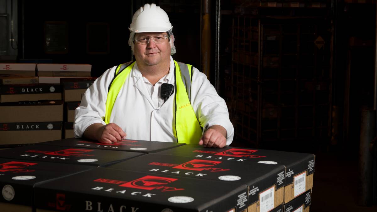 Beef City plant manager Justin McCormick with with cartons of iconic Beef City Black.