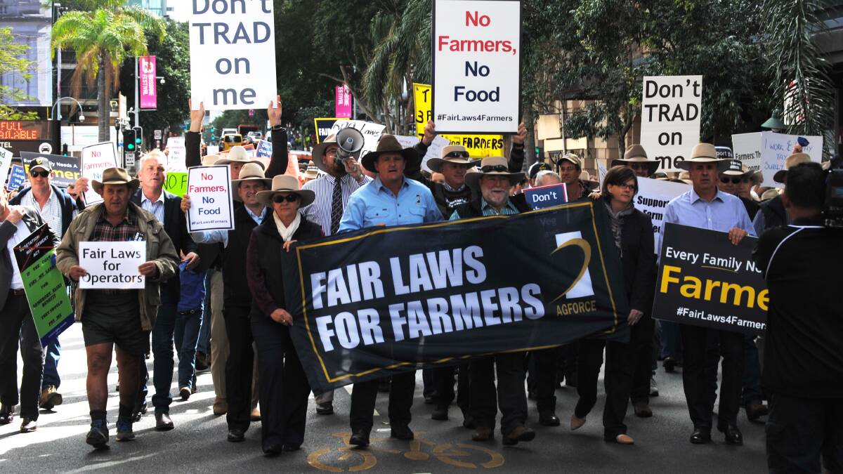 AgForce president Grant Maudsley (centre, blue shirt) earned the ire of the Palaszczuk government and the Labor-aligned extreme greens for leading a major protest by farmers in Brisbane in August.