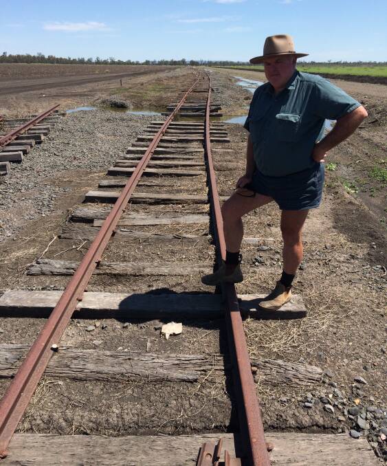 Millmerran farmer Wes Judd says he have never seen a process handled as badly as the inland rail. He is pictured with rail track destroyed in the devastating 2013 floods.