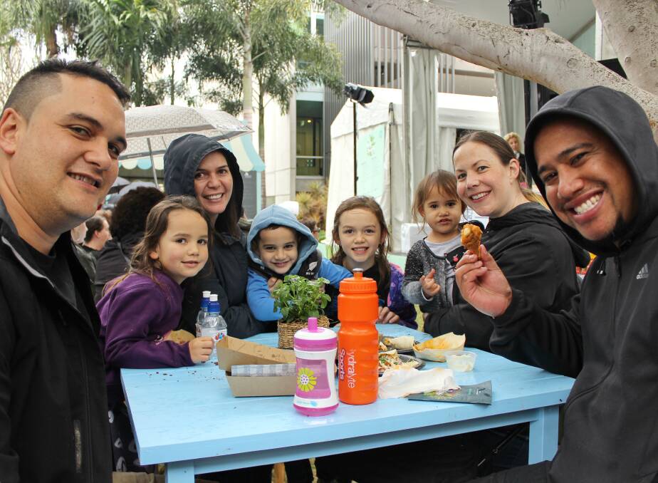 The Taihia and AhDar families from New Zealand and Brisbane dig in at lunchtime at Regional Flavours.