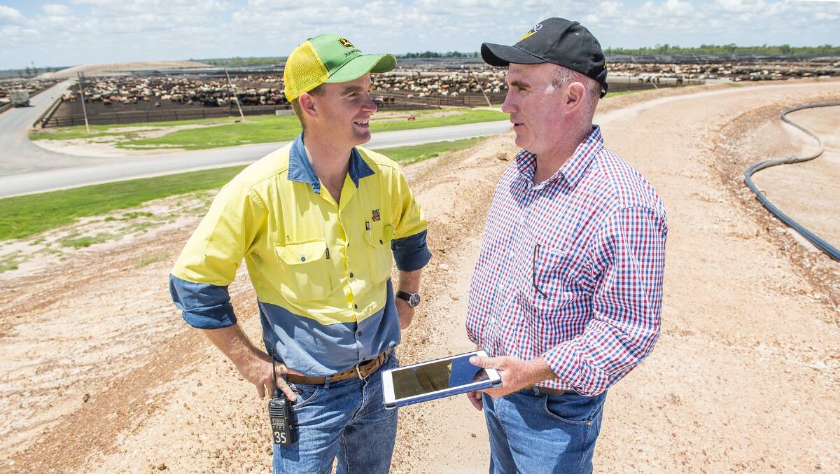 Mort & Co’s Grassdale Feedlot manager Jordan Peach (left) discusses seasonal outlooks with USQ climate scientist Dave McRae.