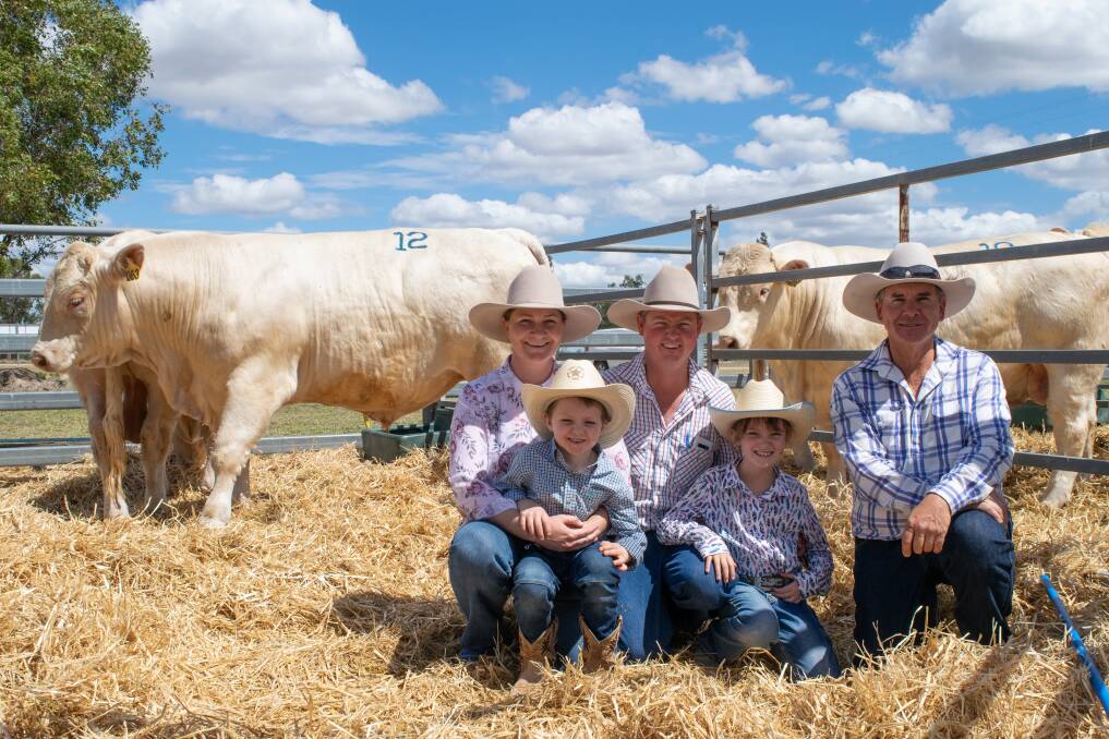 Vendor Stephen Kajewski (right) with volume buyers in Friday's sale, Andrew and Tammy Richardson from Cloncurry with Darcy 7, and Sarah 8. 