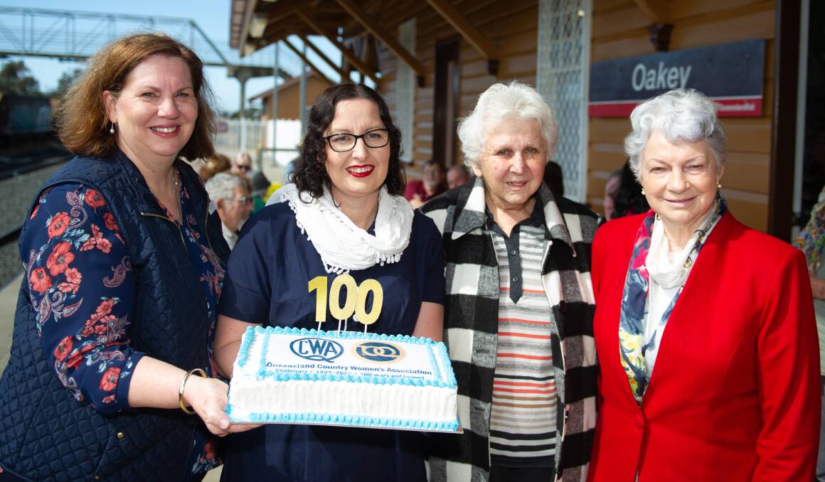 QCWA Oakey president Wendy Gordon, Toowoomba president Mary Cole, Highfields president Gladys McKay and Darling Downs division president Elaine Kieseker celebrate the organisation's centenary at the Oakey Information Centre. Pictures: Brandon Long
