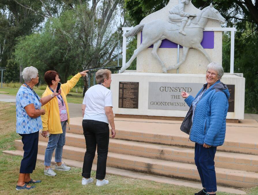 A bus tour visits the Gunsynd The Goondiwindi Grey statue. Picture: GRC