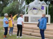 A bus tour visits the Gunsynd The Goondiwindi Grey statue. Picture: GRC