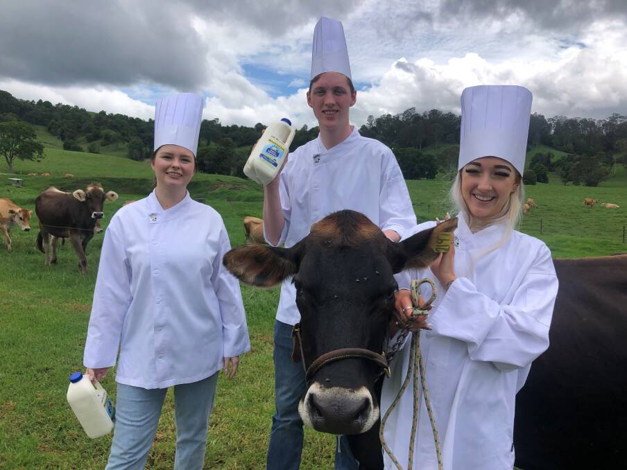 COW GOOD: The Star's young hospitality workers Cassie Chick, Alex Stewart and Ella McKay get a lesson in dairying. Photos: Supplied