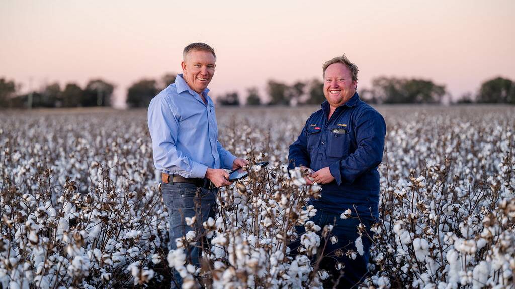 DataFarming managing director Tim Neale talking tech with customer and Queensland cotton farmer Fraser Bligh. Picture: Supplied