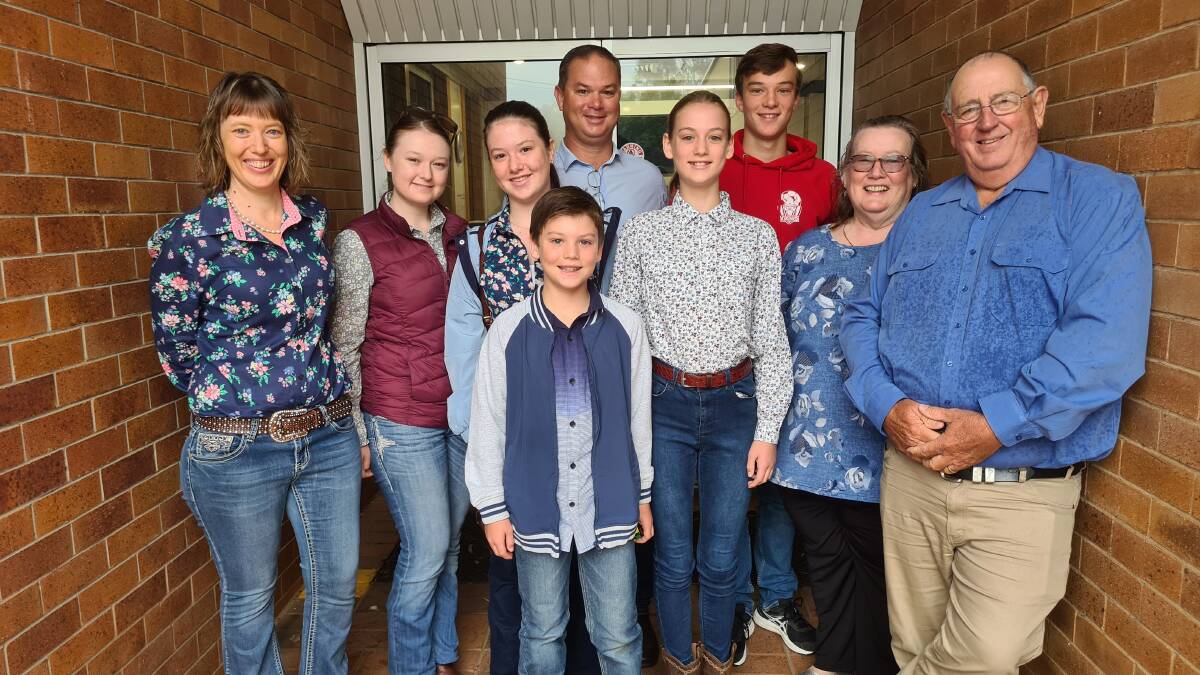 FAMILY RUN: Katrina and Adrian Hobbs (left, centre), their five children, and Katrina's parents, Jennifer and Andrew Youngberry. Photo: Supplied