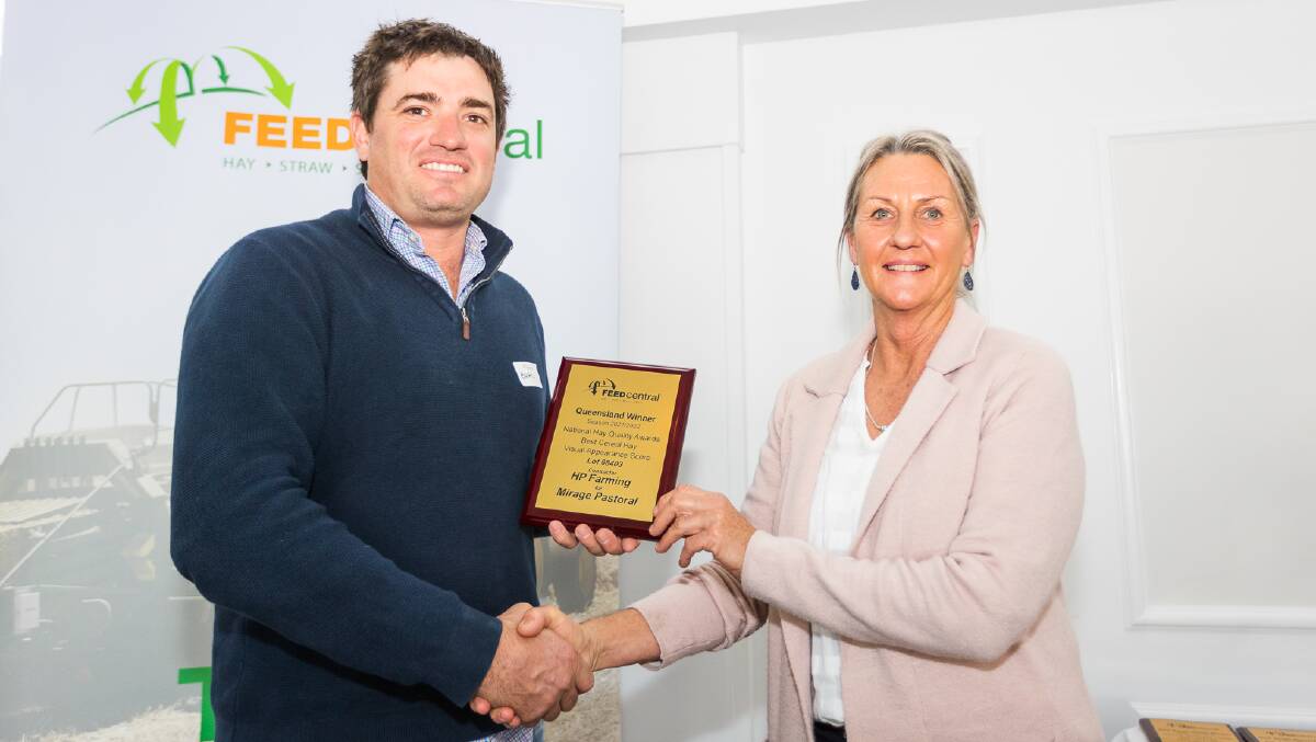 AFIA chair Brad Griffiths presents Gayle Lancaster of HP Contracting with a state award. HP Contracting for Mirage Land and Water won the national title for best cereal hay visual appearance and feed test. Picture: Feed Central