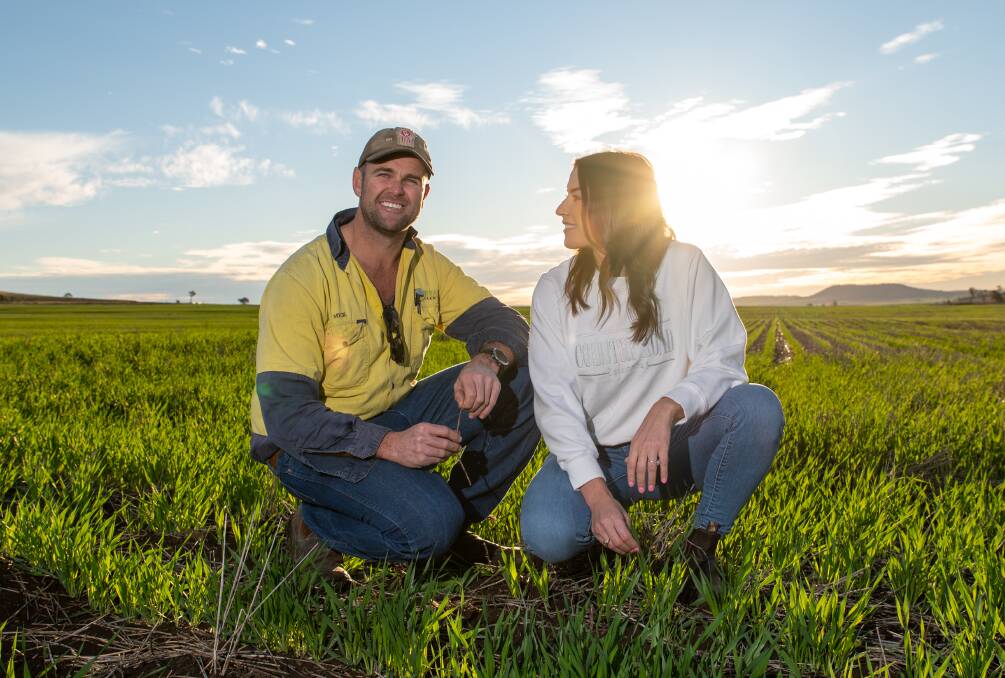 Pilton Valley farmers Michael Ryan and fiancee Alyson Hackett in their barley crop. Picture: Brandon Long