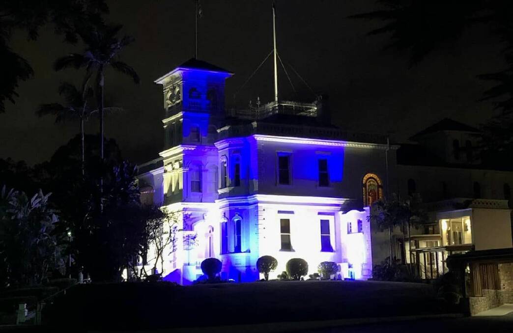 In celebration of the QCWAs centenary, Government House is lit blue and white. Picture: Queensland Governor