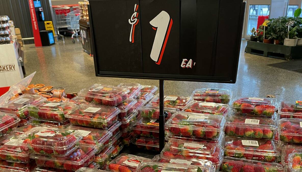 PRICES SLASHED: Strawberry punnets for $1 at Coles on Friday. Photo: Brandon Long.
