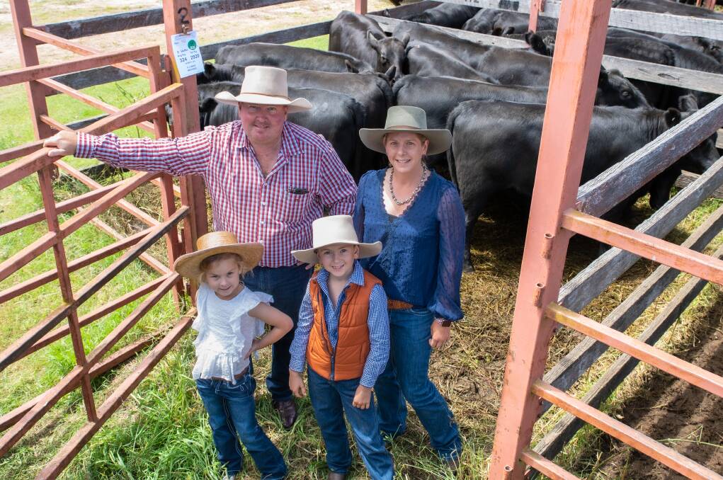 TOP GIRLS: Michael, Jessica, Bobbie and Jack Smith, Adrigoole Angus, Woodenbong, won champion pen of Angus heifers for a 324kg pen which sold for 790c/kg to return $2563. Photos: Brandon Long