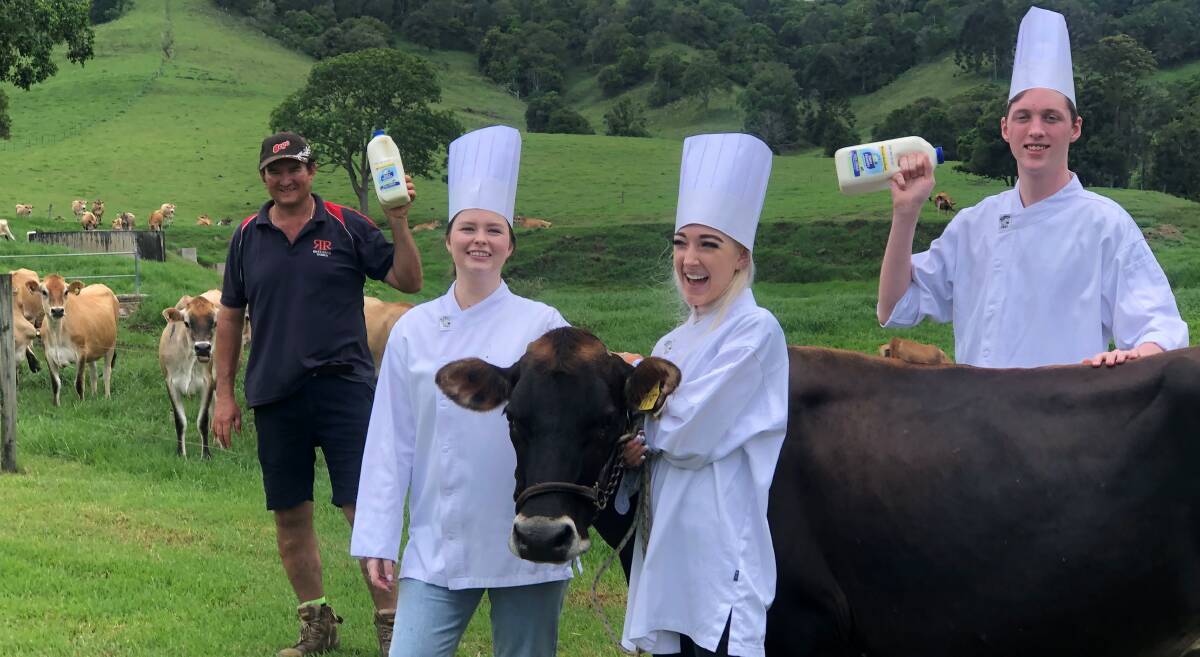 OUTDOOR EDUCATION: Ridge River Dairies owner Ray DeVere with young hospitality workers from The Star, Cassie Chick, Ella McKay and Alex Stewart. Photos: Supplied