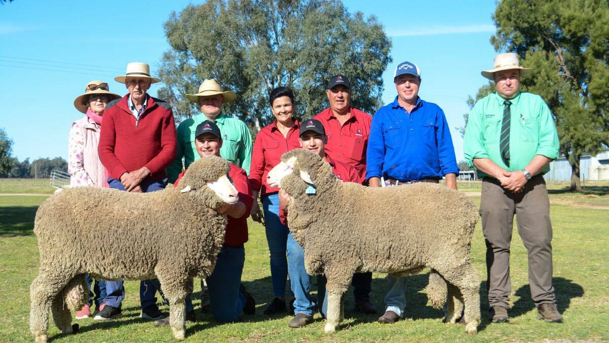 Claudette and Gerald Woodhouse, Myack Poll Merinos, John Settree, Nutrien, Mitch, Cam, Margot and Glen Rubie, Lachlan Merinos, Scott Gibson, Bald Ridge, and Brad Wilson, Nutrien, with the two top-priced rams, which sold for $8500 each. Picture by Elka Devney.