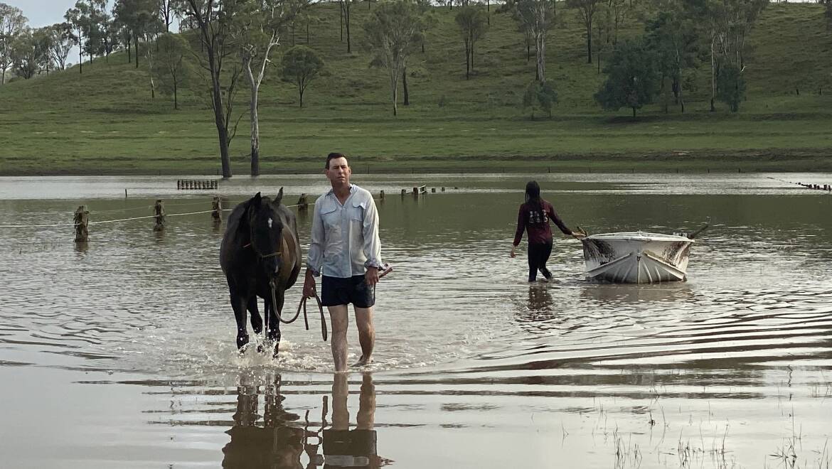 Huon Smith and Baylee Evans used a boat to rescue their mares from floodwaters. Photo: Boonara Performance Horses