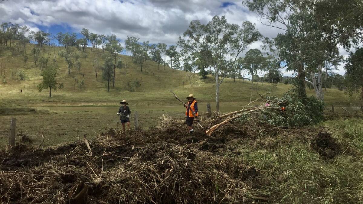 BlazeAid workers clearing debris from fence lines in the South Burnett area. Photo: Supplied