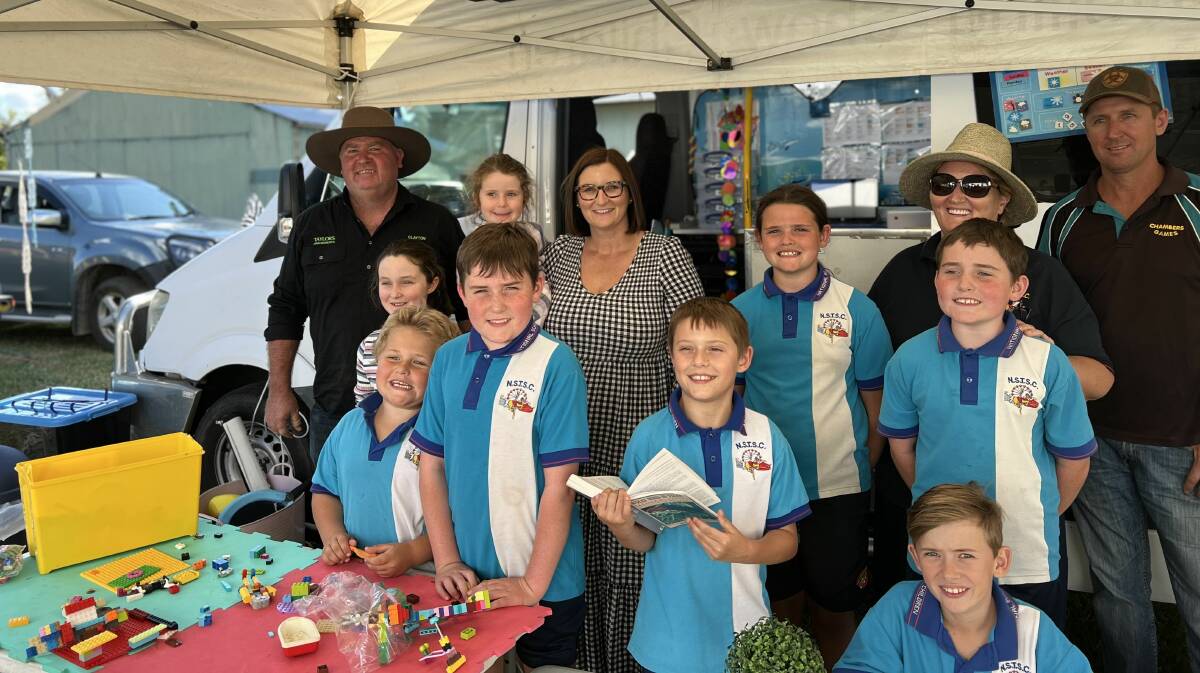 A group of the travelling show school students with New South Wales education minister Sarah Mitchell (middle) and teacher Kate Jones (right) at the Gunnedah show this year. Photo: Supplied