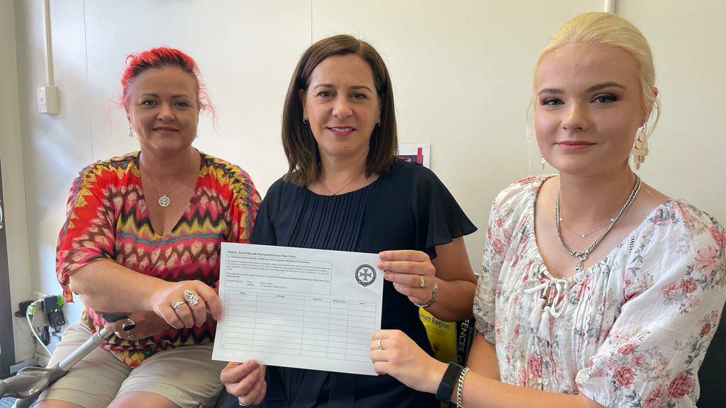 Erin Milne, MP Deb Frecklington and Kyla Milne, with their petition for a chronic pain clinic in the South Burnett region. Photo: Supplied