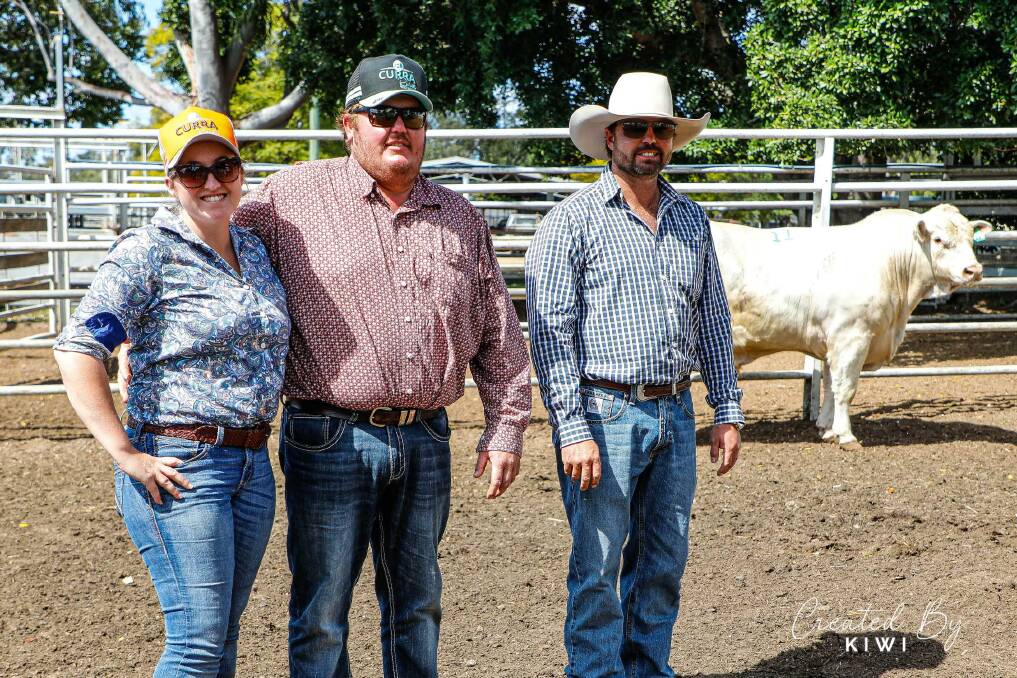 Abbey and Levi Rickertt of Curra Rural, Kilcummin with Mark Hopgood of Hopgood Charolais and their top priced bull Hopgood Ripper, which they purchased for $22,000 in Clermont. Picture by Created by Kiwi.