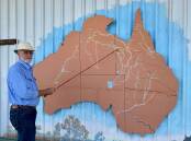 Ballina volunteer Ron Stalenberg guides tours at the Droving Heritage Museum and is seen here with a map of the droving stock routes. Photo: The Drovers Camp.
