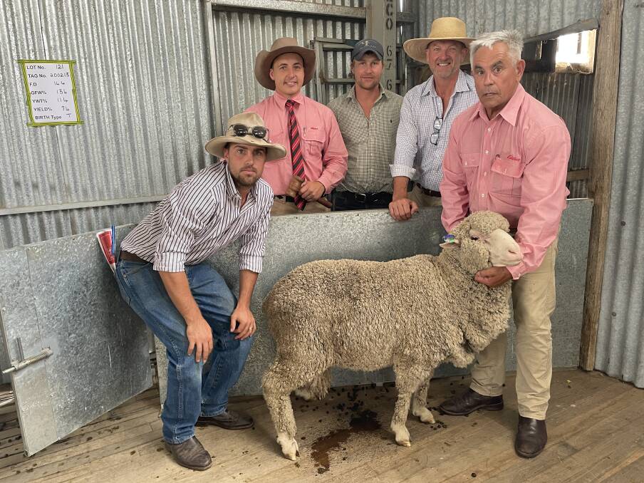 With the $11,000 top-priced ram are Lachlan McGuiness, Eupon Downs, Hovells Creek, auctioneer Lincoln McKinlay, Ben Patrick, Accelerate Ag, Tas, Sean Duggan, Woodstock, and Elders Walcha wool manager Tom Henry. Pictures by Simon Chamberlain