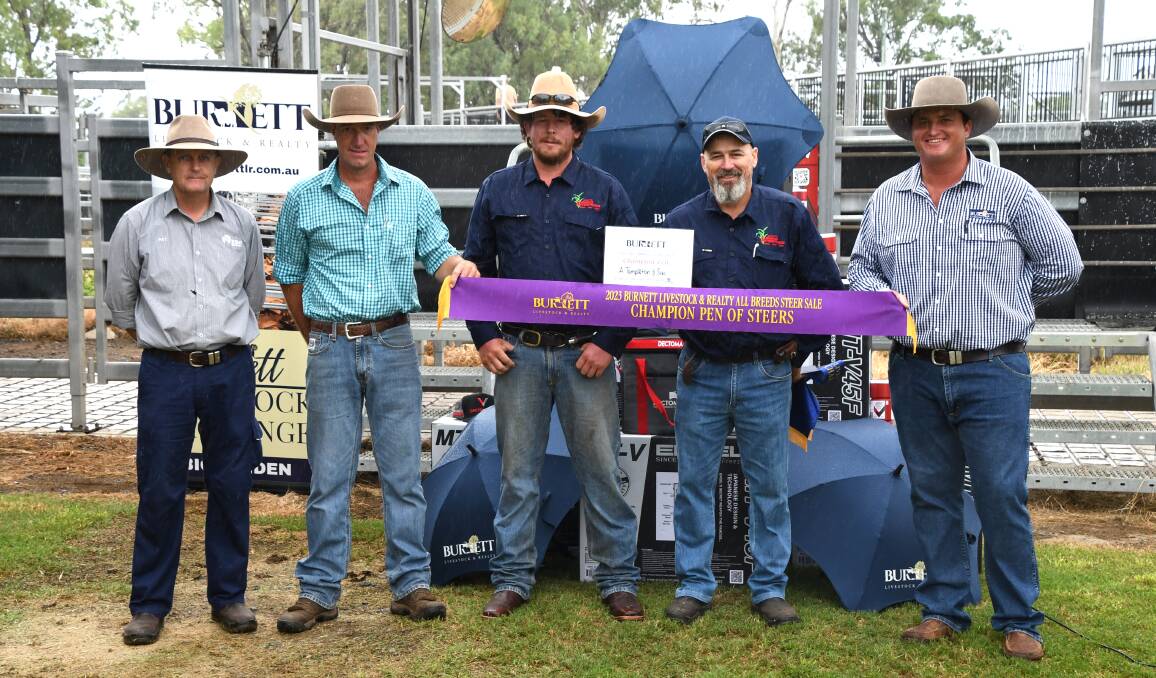 A Templeton & Son, Eumundi, team members Lachlan McMahon (third left) and Tony Mills (second right) presented champion pen by sponsor Pat Harden, judge Craig Forrest and James Cochrane from Burnett Livestock and Realty. Picture: Brad Marsellos