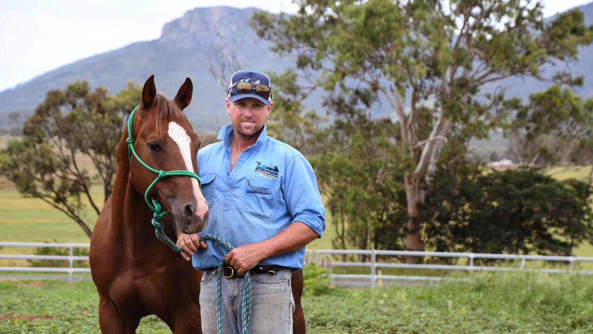 Horse trainer Nathan Wilson at his Biggneden property with Brother Tuff Wood that recently sold for $300,000. Picture: Brad Marsellos