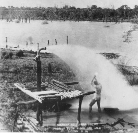 Man bathing in the water from an artesian bore in the Cunnamulla district, Queensland, ca. 1894. Picture: State Library of Queensland