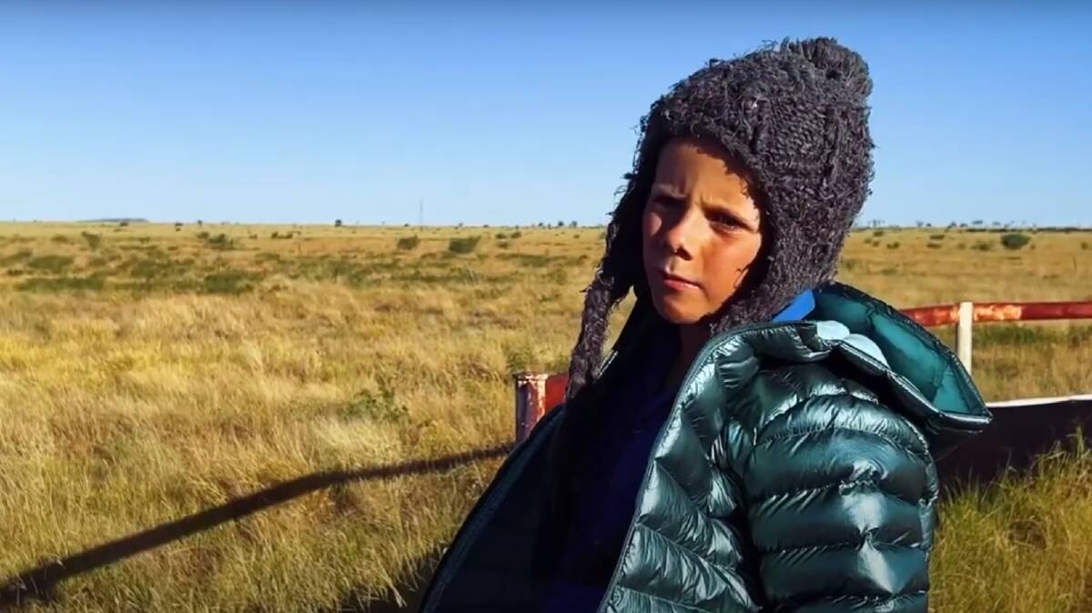 Oliver Seccombe 8, not sure how he will go in the cold weather when he travels 200 kilometres to the snow from Muttaburra for the school camp. Picture: Josh Arnold