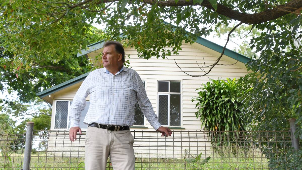 Member for Burnett Stephen Bennett outside the empty Givelda school house he beilieves could help a family, on the outskirts of Bundaberg. Picture: Brad Marsellos