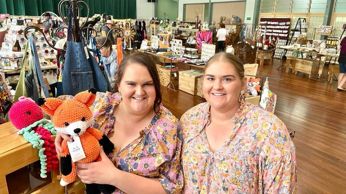Lynette Vicary and Emily Vicary in the Christmas shop they helped create in the Mundubbera hall. Picture: Brad Marsellos