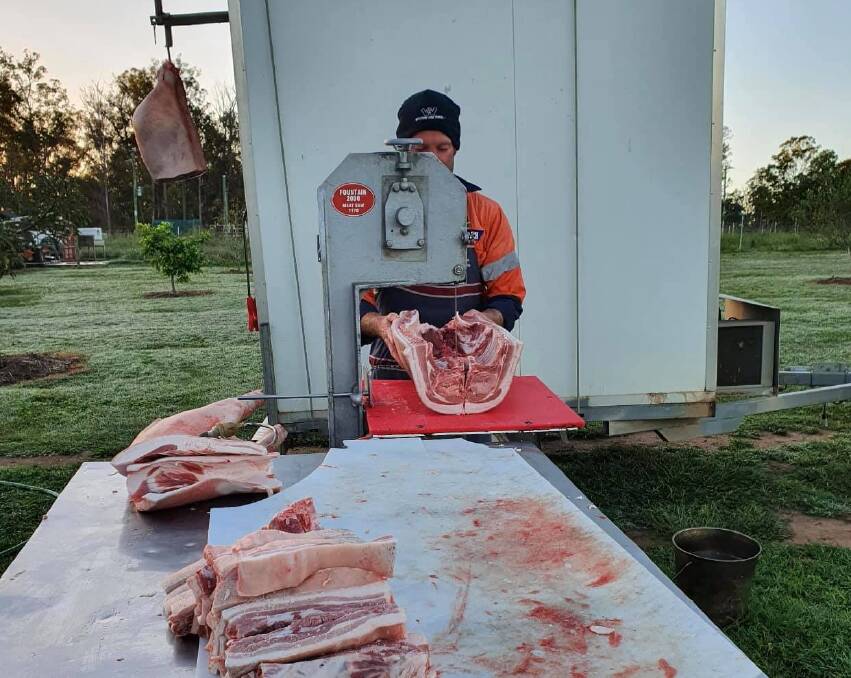 Josh Retschlag processing with his outdoors butcher shop on wheels. Picture: Supplied Josh Retschlag