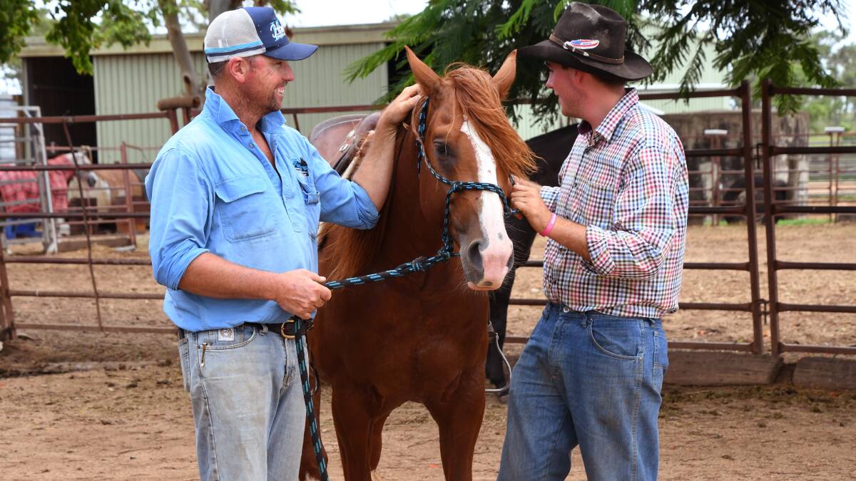 Nathan Wilson has known training hand Darby Ryan since he was a boy and now he works at his North Burnett property. Picture: Brad Marsellos