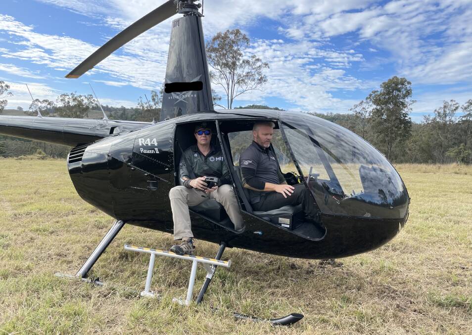  Adam Quinn and pilot Brendan Parker about to take flight. Picture: Supplied Greyman Ops