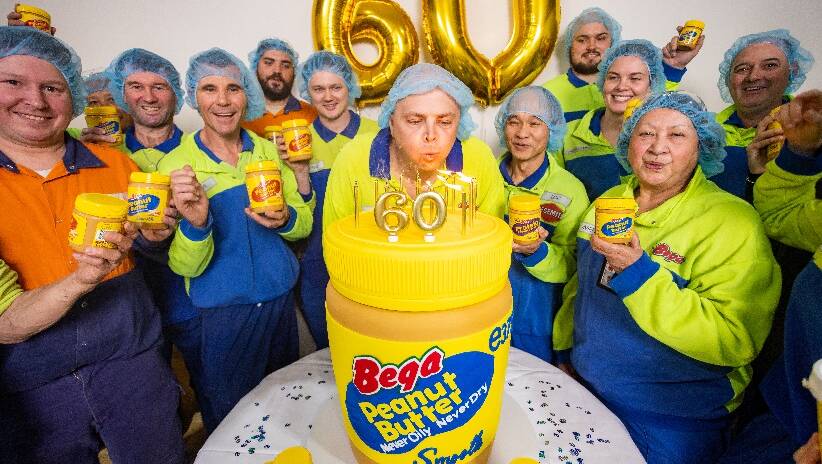 Bega employees including Vivienne Rihia (front right) celebrating 60 years of their peanut butter. Picture via Bega 