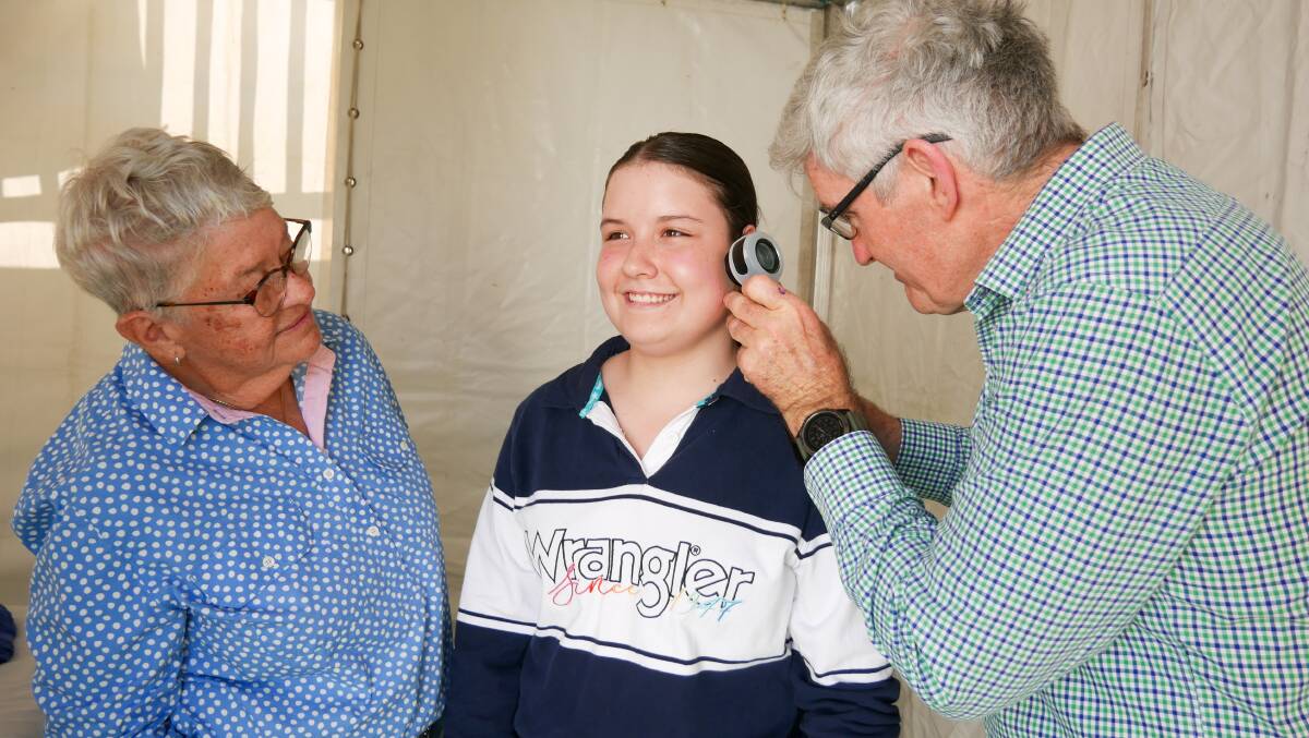 Dr Toby Ford conducts a skin cancer check on 14-year-old Caitlin Usher. Picture by Ellouise Bailey 