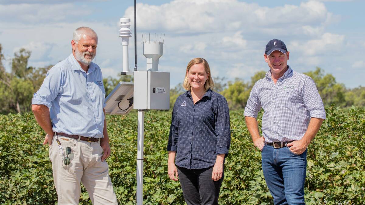 Gordon Cumming from GRDC, Susan Maas from CRDC, and Tom Dowling from Goanna Ag with a Goanna Ag weather station at Goondiwindi. Picture by Melanie Jenson.