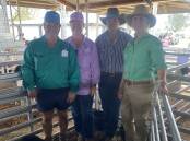 Vendors Wayne and Karen Dingle with buyers Jordan and Tammy Smith and the top price ram. Picture supplied 