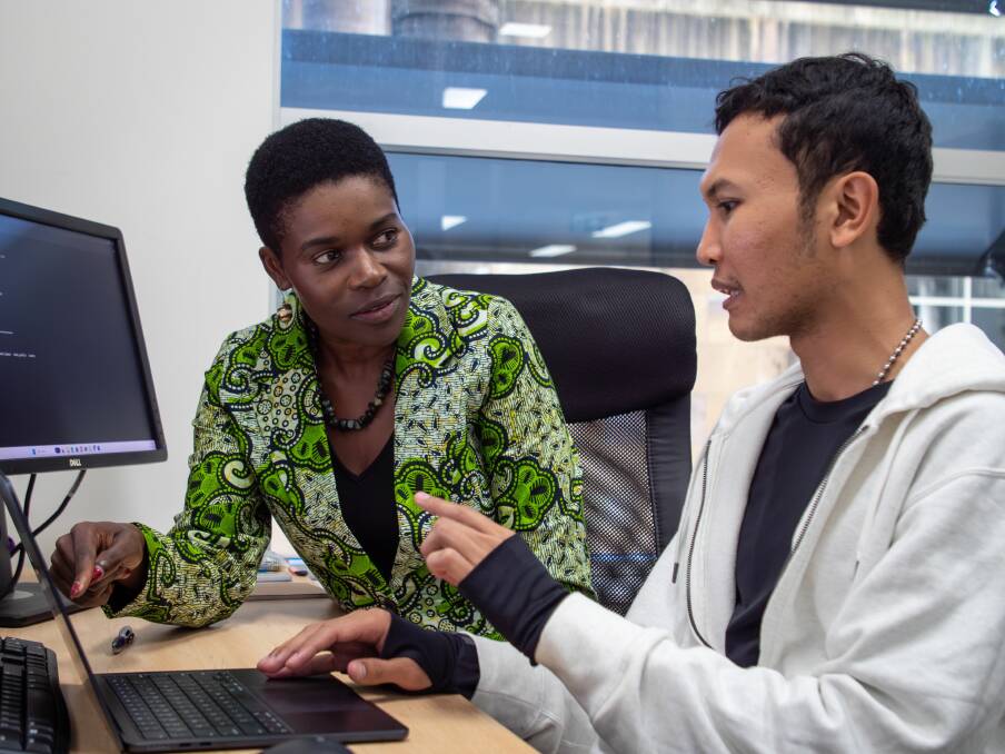 University of Queensland Associate Professor in Animal Biotechnology Dr Sheila Ommeh mentoring summer student Abdullah Hasib. Picture: Supplied