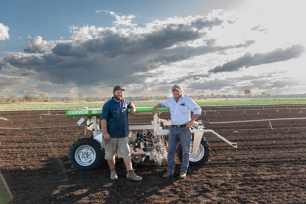 Qualipac farm technician Aaron Jess and Director Troy Qualischefski, Gatton, in front of the FarmDroid. Picture: Supplied by DAF
